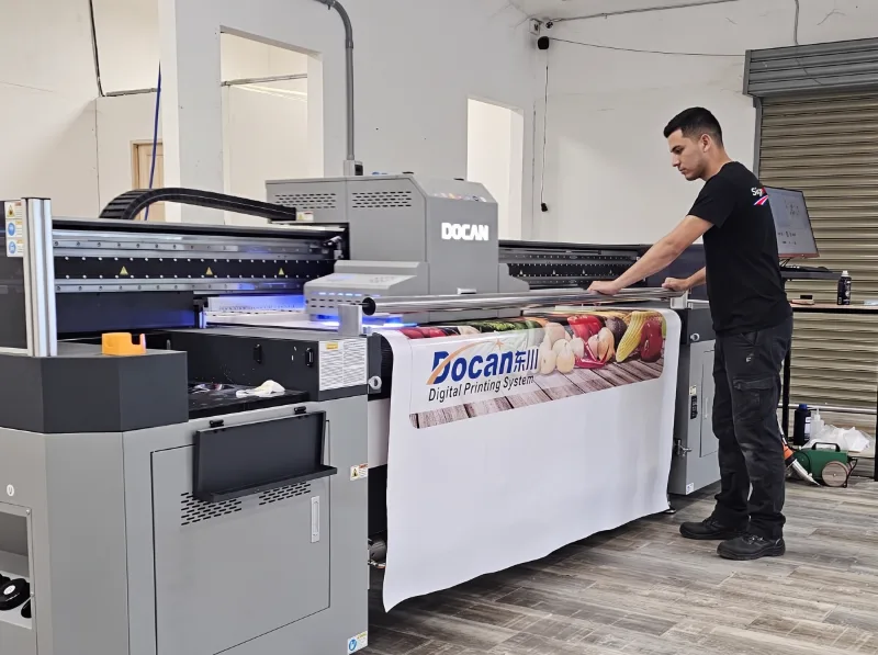 UV hybrid printer printing a banner in the SignWorks print shop in Guanacaste, Costa Rica